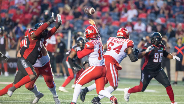 Quarterback Jake Maier of the Calgary Stampeders (12) throws the ball in the first half against the Ottawa Redblacks at TD Place.